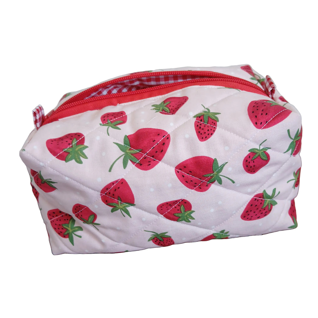 Pouch with strawberry pattern with a red zipper