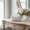 Quilted fabric with cherry pattern on a wooden surface